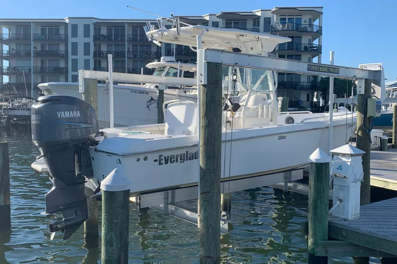 Slide: The Image of 2008 Everglades 223 Center Console boat docked with Yamaha outboard motor. - 27