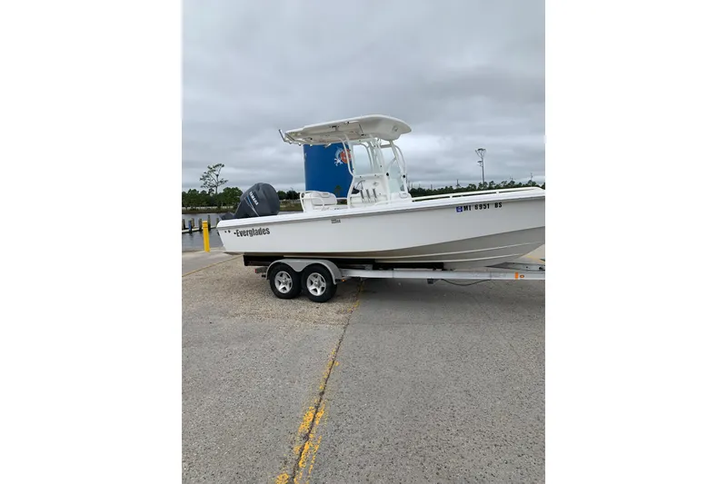 Slide: The Image of 2008 Everglades 223 Center Console boat on trailer, parked outdoors. - 29