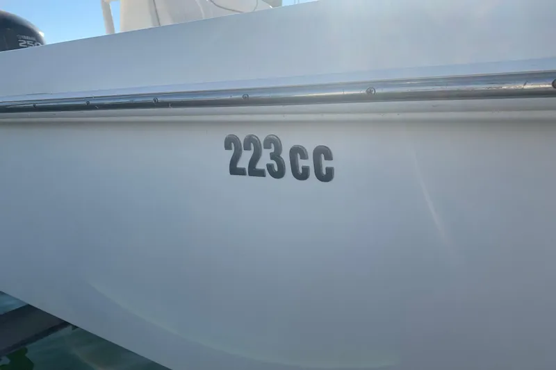 Slide: The Image of 2008 Everglades 223 Center Console boat, side view with model number "223cc" visible. - 5