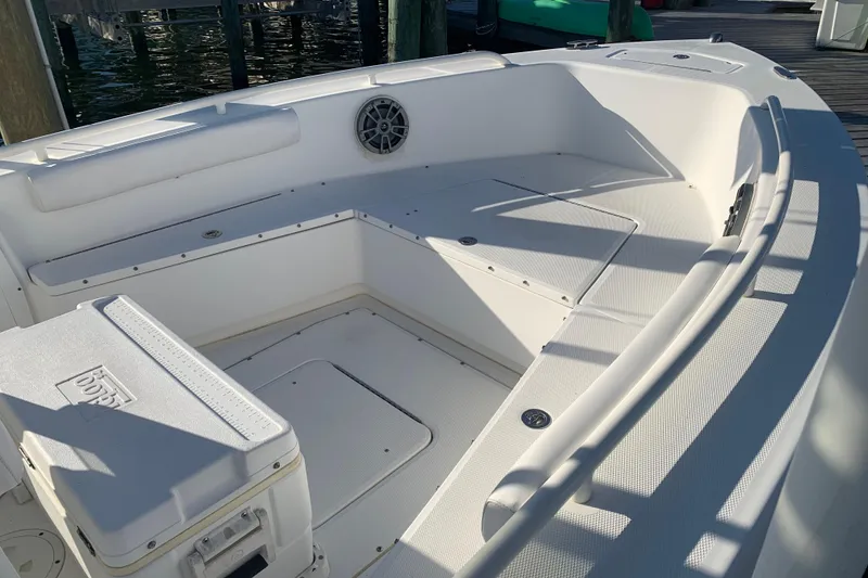 Slide: The Image of 2008 Everglades 223 Center Console boat interior with seating and storage compartments. - 6