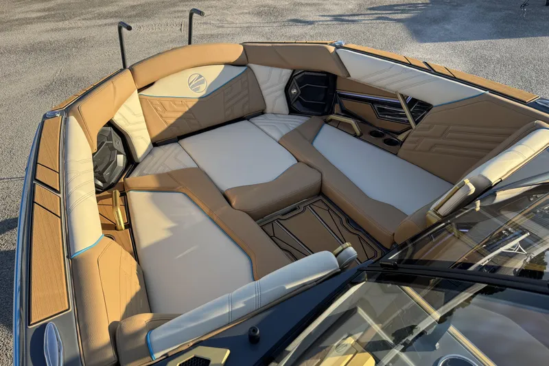 Slide: The Image of Luxurious interior of 2026 Tigé Ultré 25ZX boat with tan and white seating. - 10