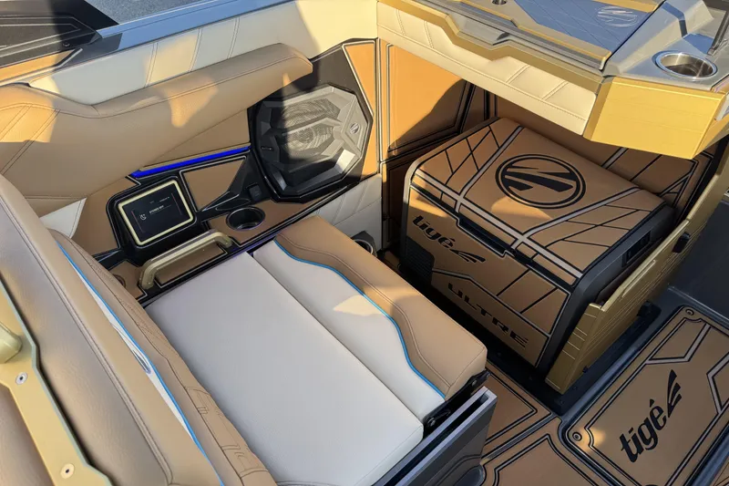 Slide: The Image of 2026 Tigé Ultré 25ZX boat interior with luxurious seating and advanced audio system. - 11