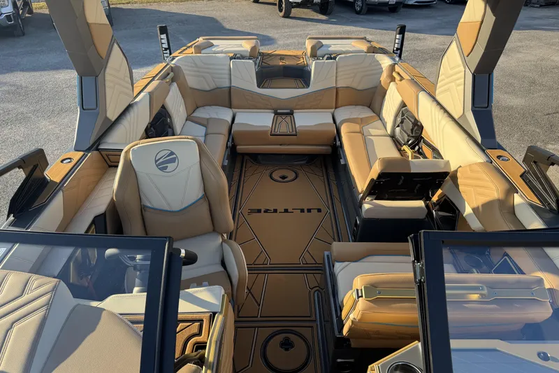Slide: The Image of 2026 Tigé Ultré 25ZX boat interior with luxurious tan seating and modern design. - 14