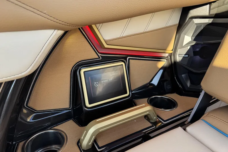 Slide: The Image of 2026 Tigé Ultré 25ZX interior with touchscreen and cup holders. - 8