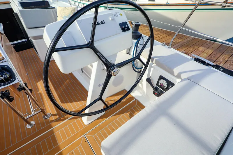 Slide: The Image of Steering wheel of 2025 Hanse 458 yacht with modern cockpit design. - 12