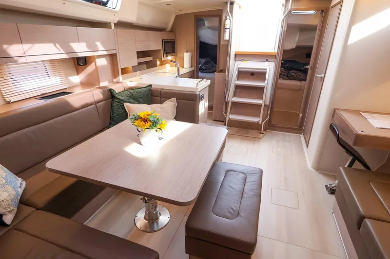 Slide: The Image of Interior of 2025 Hanse 458 yacht, featuring modern design and cozy seating area. - 17