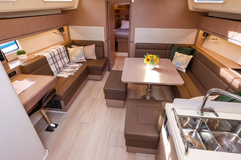Slide: The Image of Luxurious interior of 2025 Hanse 458 yacht with modern seating and dining area. - 20