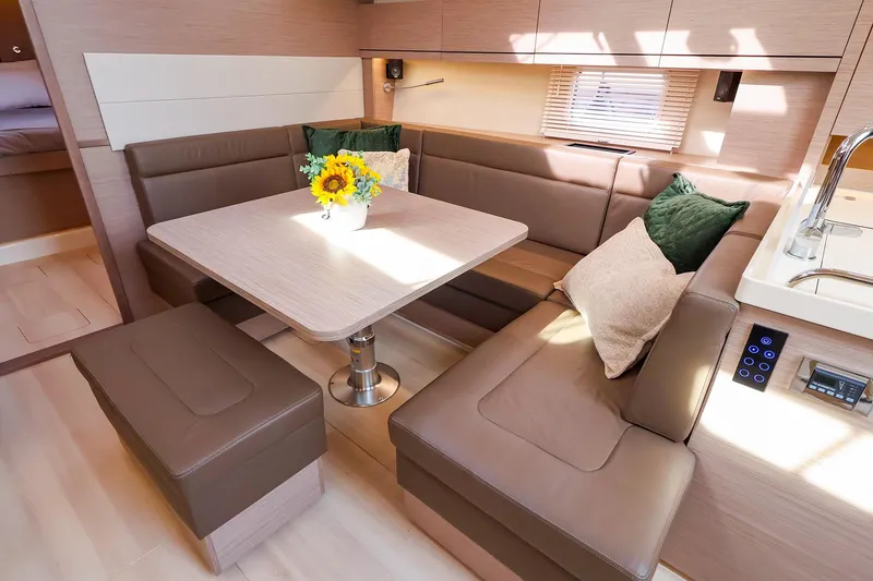 Slide: The Image of Luxurious interior of 2025 Hanse 458 yacht with cozy seating and elegant decor. - 22