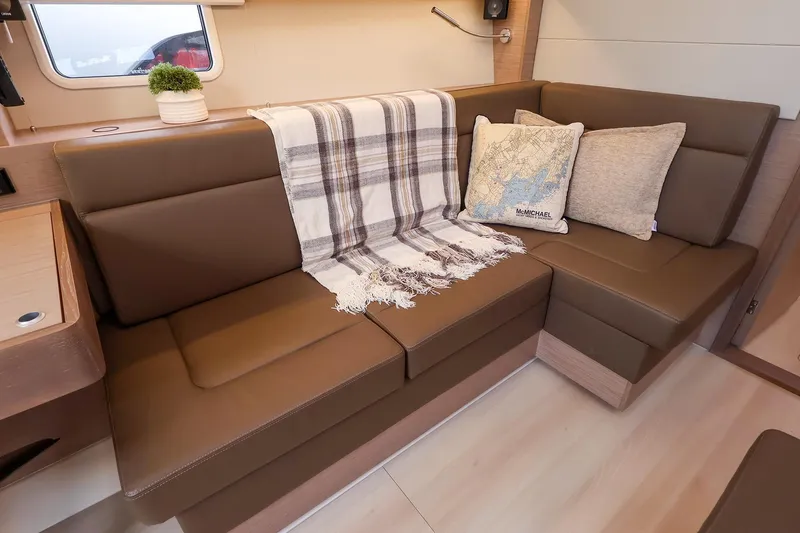 Slide: The Image of Luxurious interior of 2025 Hanse 458 yacht with cozy seating and decorative pillows. - 23