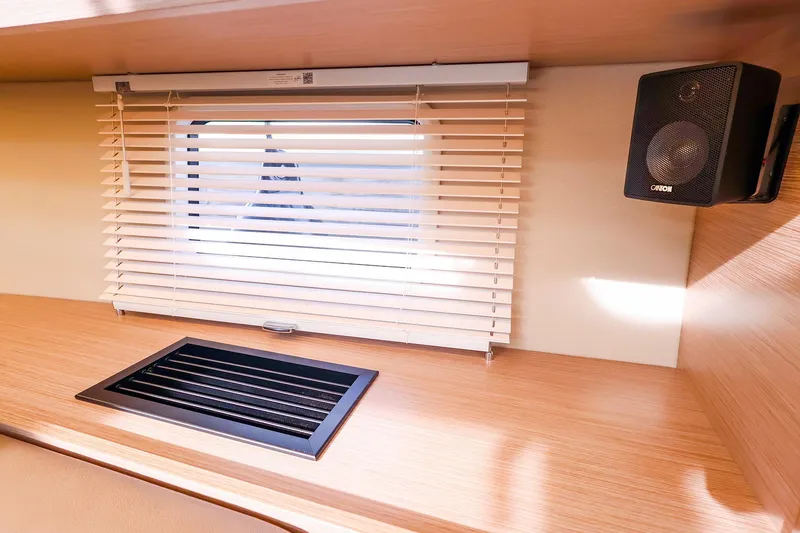 Slide: The Image of Interior of 2025 Hanse 458 yacht with window blinds and speaker. - 30