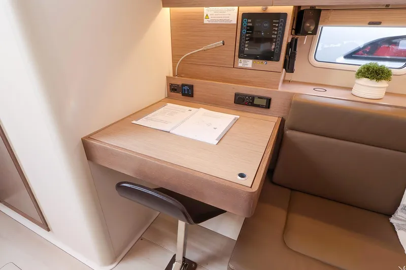 Slide: The Image of Modern interior of 2025 Hanse 458 yacht with desk, seating, and control panel. - 31