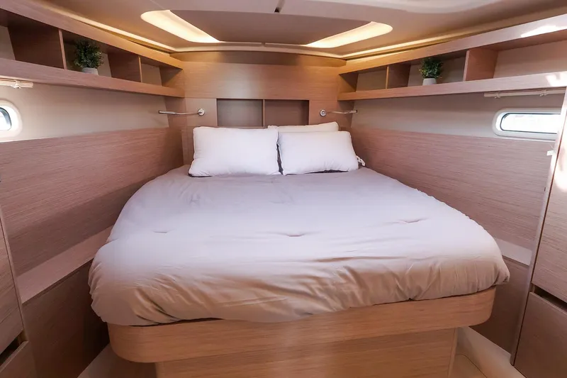 Slide: The Image of Luxurious cabin interior of 2025 Hanse 458 yacht with cozy bed and modern design. - 35