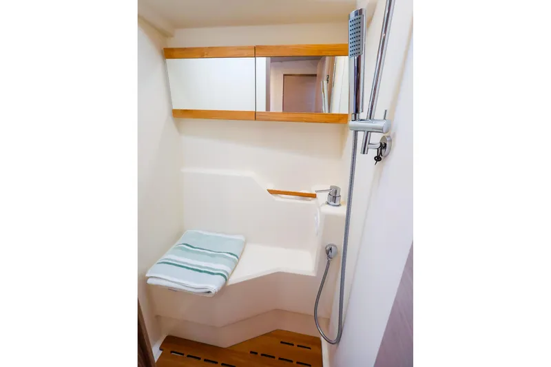 Slide: The Image of Modern bathroom in 2025 Hanse 458 yacht with shower and wooden accents. - 38