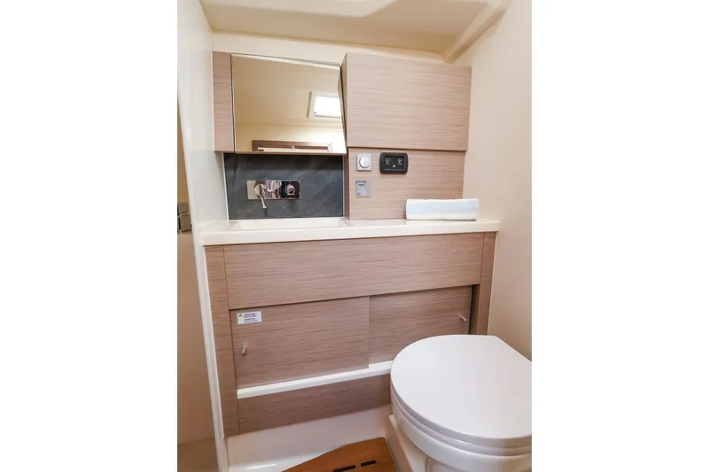 Slide: The Image of Modern bathroom interior of 2025 Hanse 458 yacht, featuring sleek cabinetry and compact design. - 39