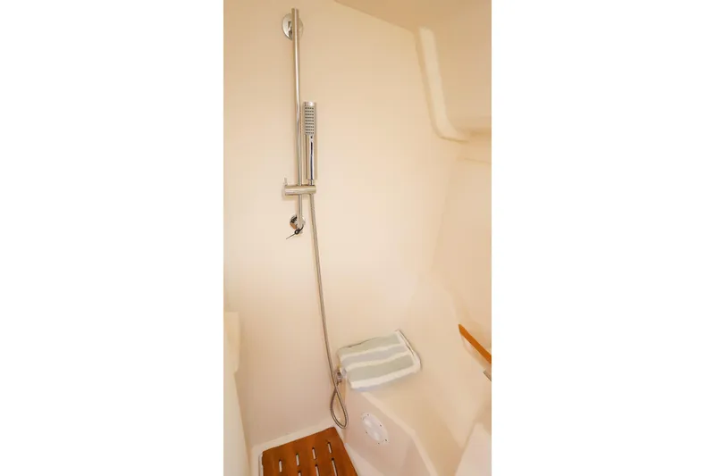 Slide: The Image of Modern shower area in 2025 Hanse 458 yacht, featuring sleek design and wooden flooring. - 40