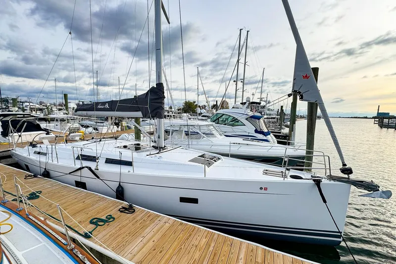 Slide: The Image of 2025 Hanse 458 yacht docked at marina under cloudy sky. - 43
