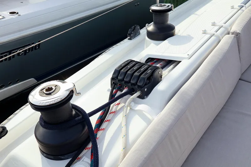 Slide: The Image of Deck of 2025 Hanse 458 yacht featuring winches and rope clutches. - 5