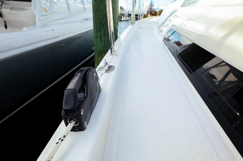 Slide: The Image of 2025 Hanse 458 yacht deck with rigging equipment, docked at marina. - 6