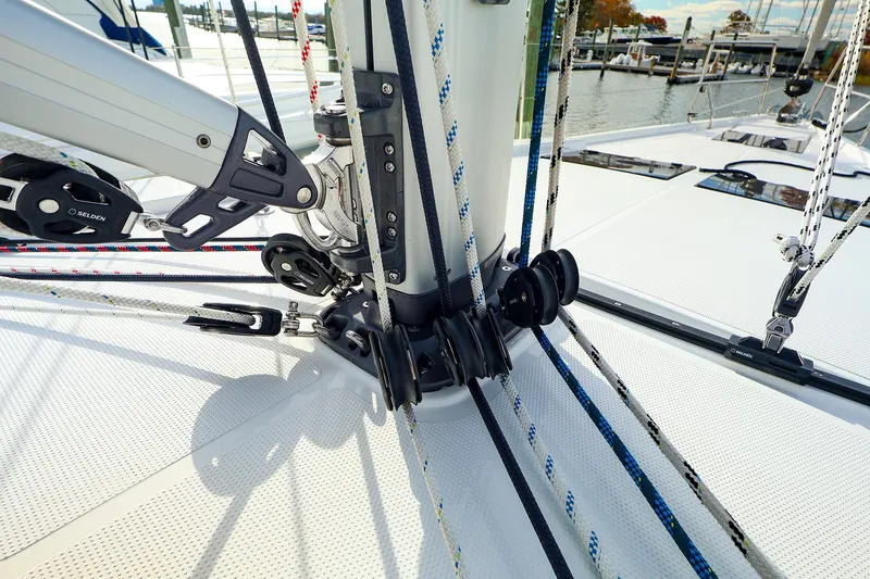 Slide: The Image of Close-up of rigging on a 2025 Hanse 458 sailboat, showcasing ropes and pulleys. - 7