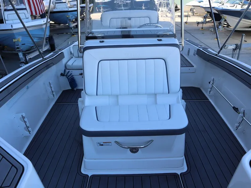 Slide: The Image of 2019 Yamaha Boats 210 FSH Sport interior with white seating and sleek design. - 15