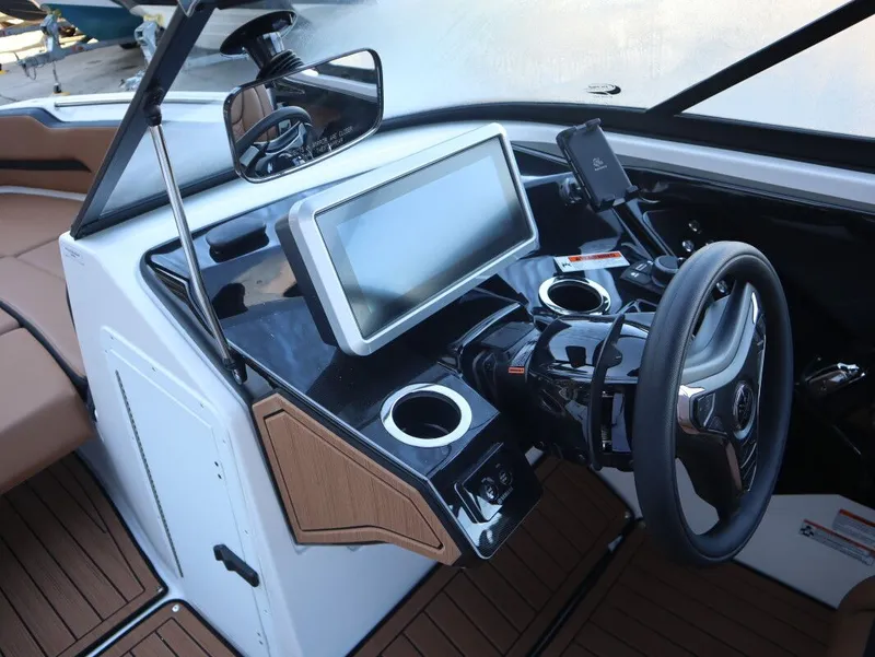 Slide: The Image of 2026 Yamaha Boats 252SD dashboard with touchscreen, steering wheel, and modern controls. - 11