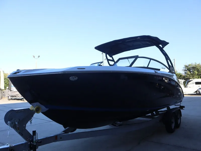Slide: The Image of 2026 Yamaha Boats 252SD on trailer, sleek design under clear blue sky. - 4