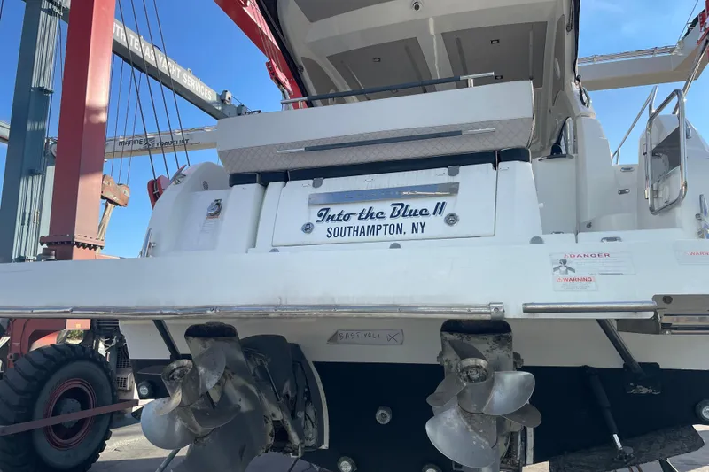 Slide: The Image of 2019 Jeanneau Leader 33 yacht docked at a marina, showcasing sleek design and modern features. - 2