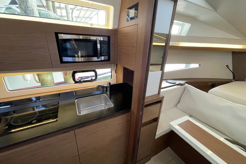 Slide: The Image of Interior of 2019 Jeanneau Leader 33 yacht with modern design and cozy seating area. - 24