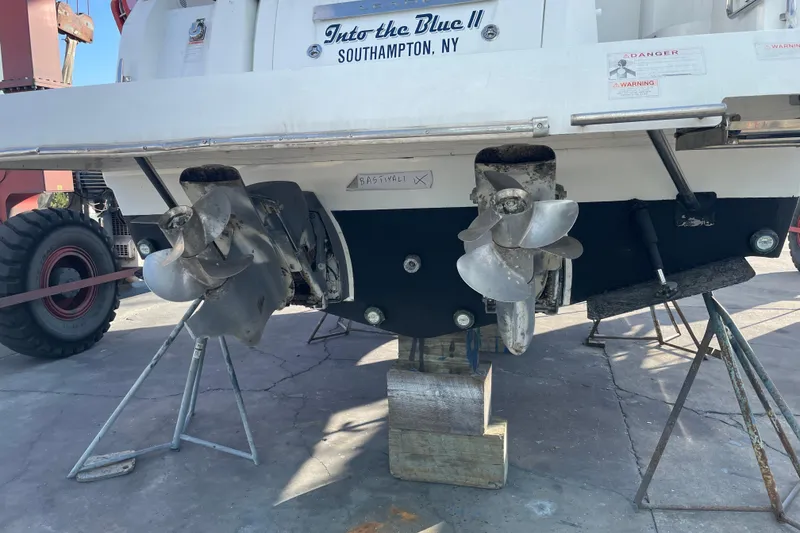 Slide: The Image of 2019 Jeanneau Leader 33 yacht docked under a wooden shelter. - 3