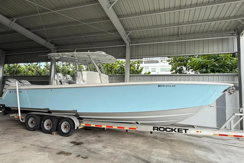 The Image of 2019 Contender 35 ST boat on trailer in covered storage area. - 0