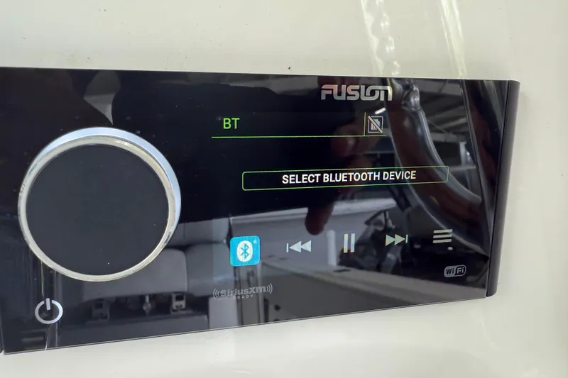 Slide: The Image of Fusion audio system display in a 2019 Contender 35 ST, showing Bluetooth device selection. - 13