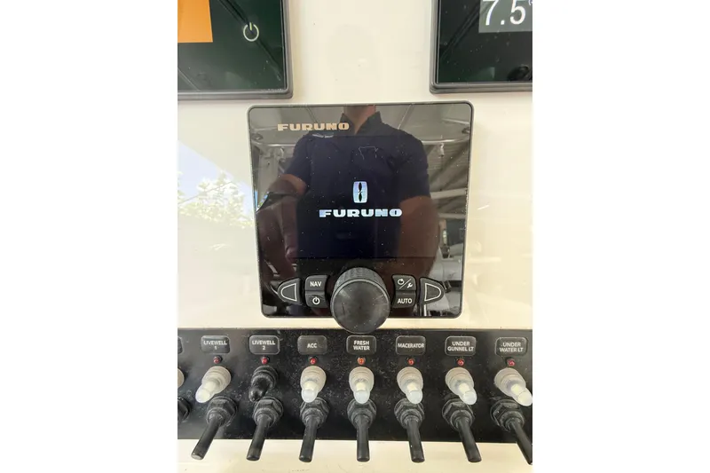 Slide: The Image of Control panel of a 2019 Contender 35 ST boat with Furuno display. - 15