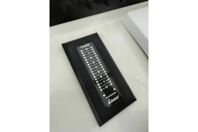 Slide: The Image of Trim tab indicator on 2019 Contender 35 ST boat dashboard. - 16