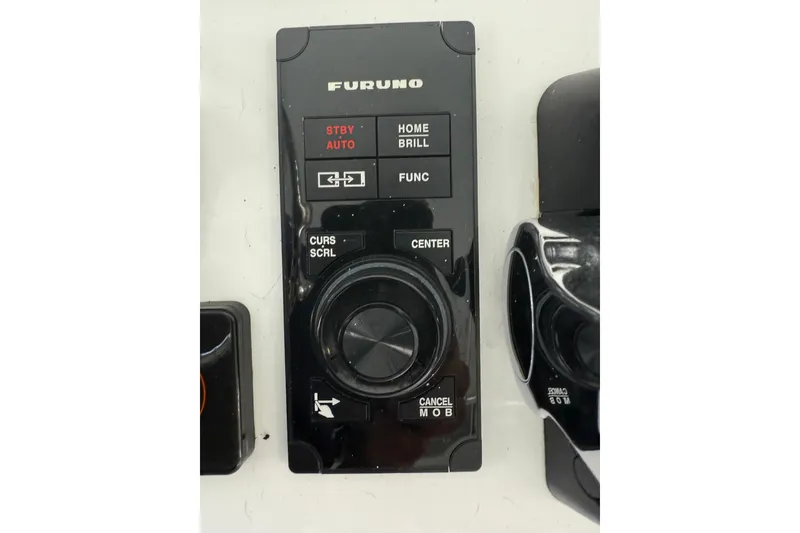 Slide: The Image of Furuno control panel on 2019 Contender 35 ST boat dashboard. - 17