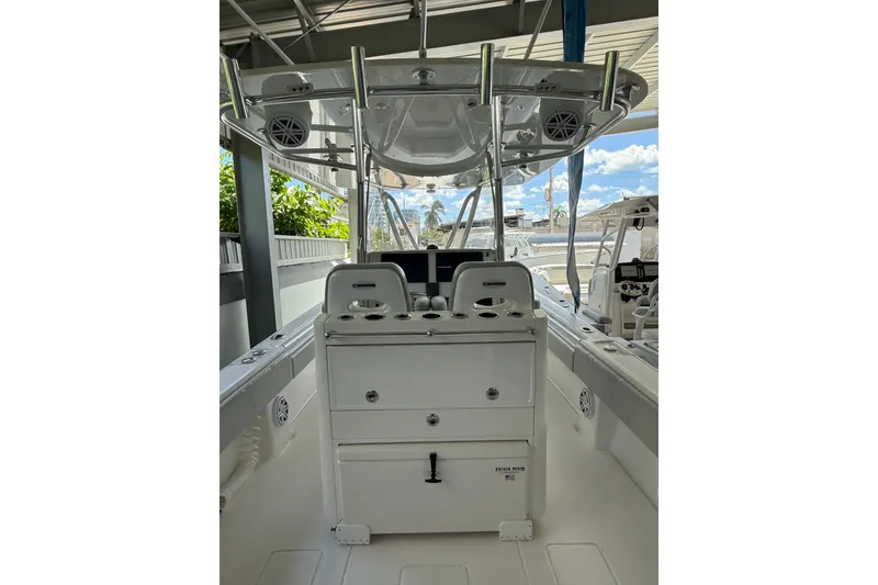 Slide: The Image of 2019 Contender 35 ST boat interior with helm station and seating under a canopy. - 18