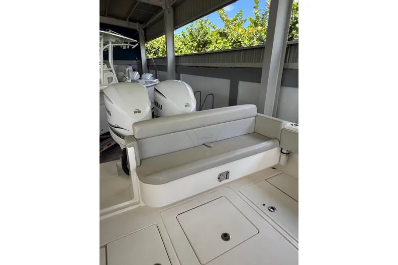 Slide: The Image of 2019 Contender 35 ST boat with Yamaha engines and cushioned seating. - 19