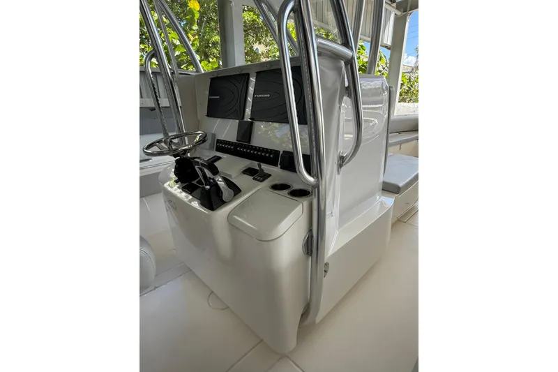 Slide: The Image of 2019 Contender 35 ST boat console with steering wheel and navigation screens. - 21