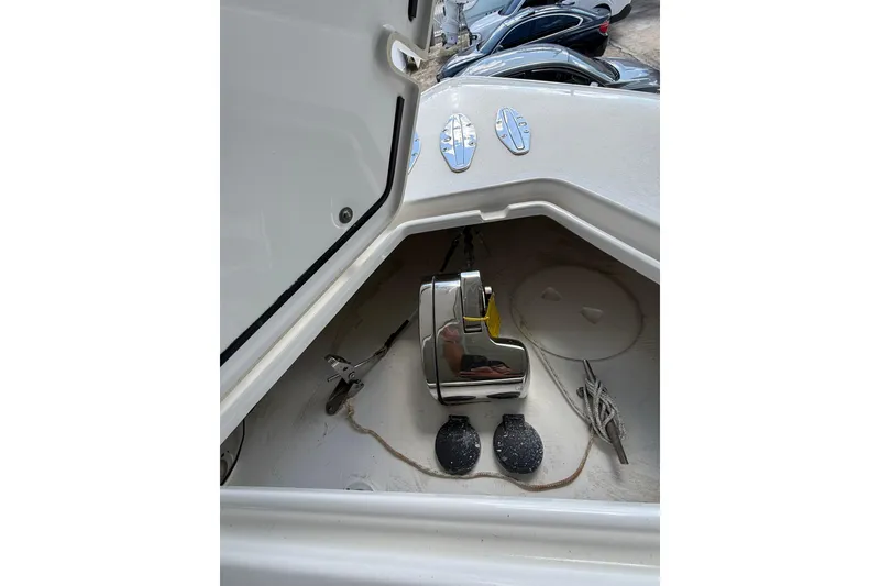 Slide: The Image of 2019 Contender 35 ST boat anchor compartment with chrome fittings and ropes. - 23