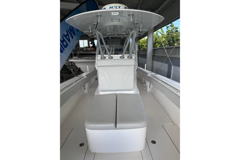 Slide: The Image of 2019 Contender 35 ST boat interior with seating and T-top under shelter. - 26