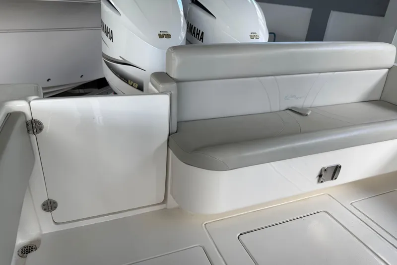 Slide: The Image of 2019 Contender 35 ST boat interior with Yamaha V8 engines and cushioned seating. - 32