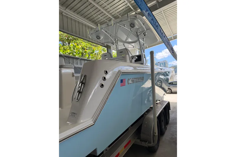 Slide: The Image of 2019 Contender 35 ST boat on trailer under shelter, side view. - 5