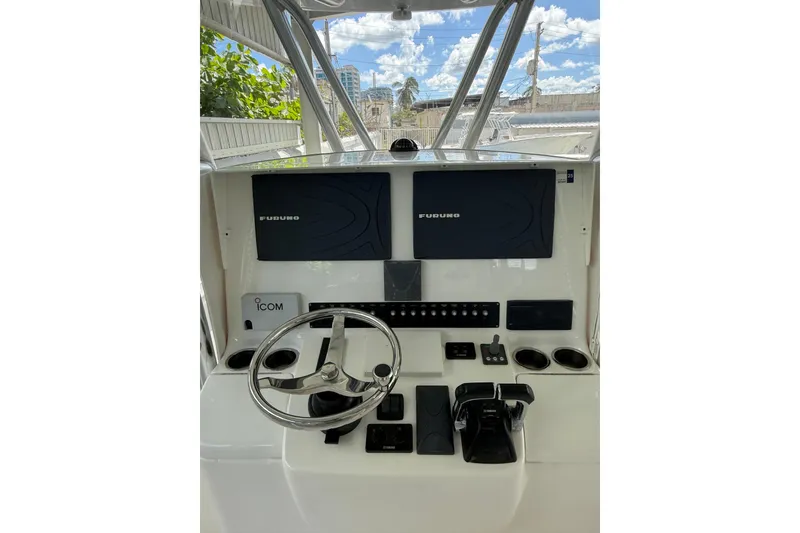 Slide: The Image of 2019 Contender 35 ST boat dashboard with Furuno displays and Icom equipment. - 7
