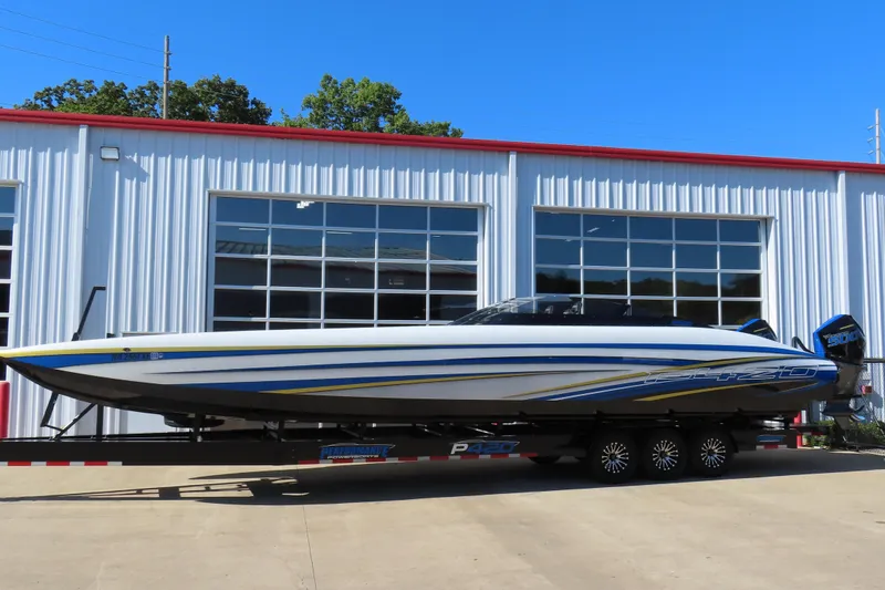 The Image of 2025 Performance Powerboats P420 on trailer, parked outside a garage. - 0