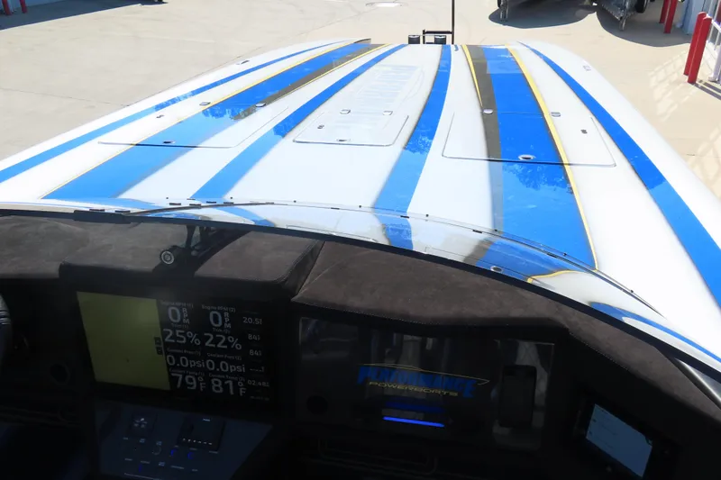 Slide: The Image of 2025 Performance Powerboats P420 dashboard view with blue and white exterior design. - 12