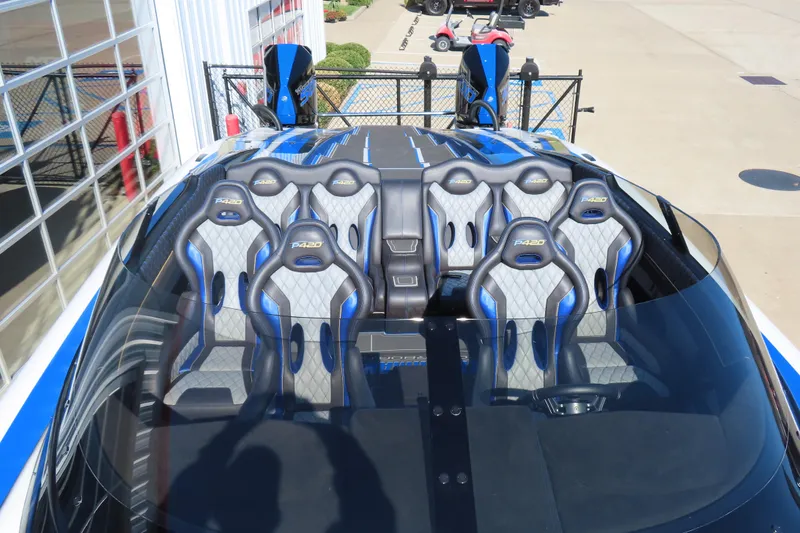 Slide: The Image of 2025 Performance Powerboats P420 interior with blue and gray seats, showcasing luxury design. - 4