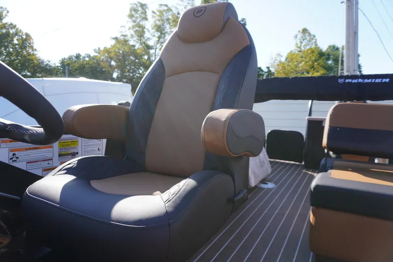 Slide: The Image of Luxurious tan and black captain's chair on 2026 Premier 250 Solaris RS boat. - 14