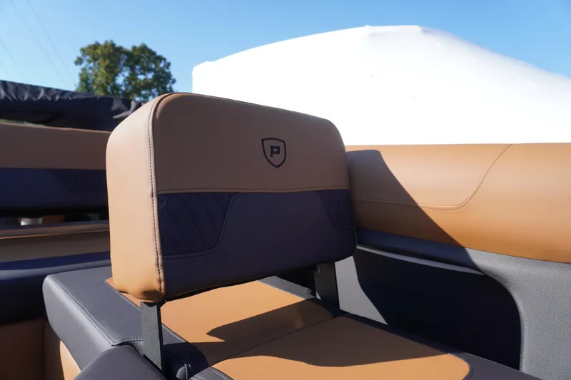 Slide: The Image of Luxurious seating on 2026 Premier 250 Solaris RS boat, featuring tan and black upholstery. - 15