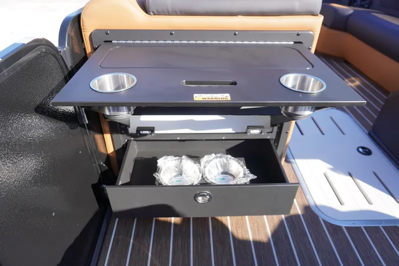 Slide: The Image of Interior of 2026 Premier 250 Solaris RS boat with seating and storage compartment. - 17