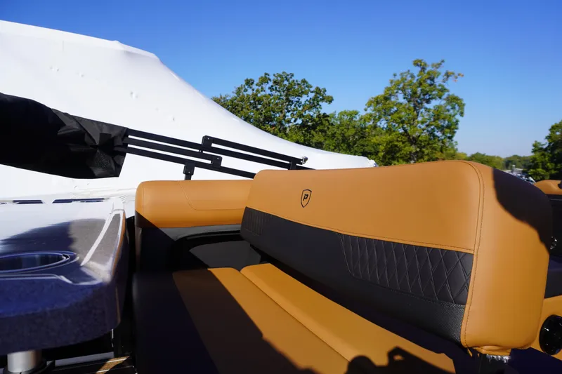Slide: The Image of 2026 Premier 250 Solaris RS boat interior with tan and black seating, showcasing luxury design. - 20