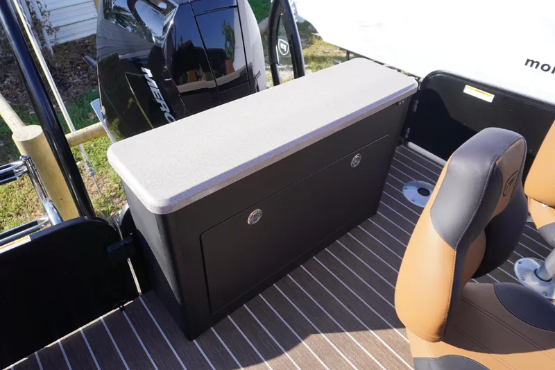 Slide: The Image of Premier 250 Solaris RS 2026 boat interior with table and tan seating. - 22